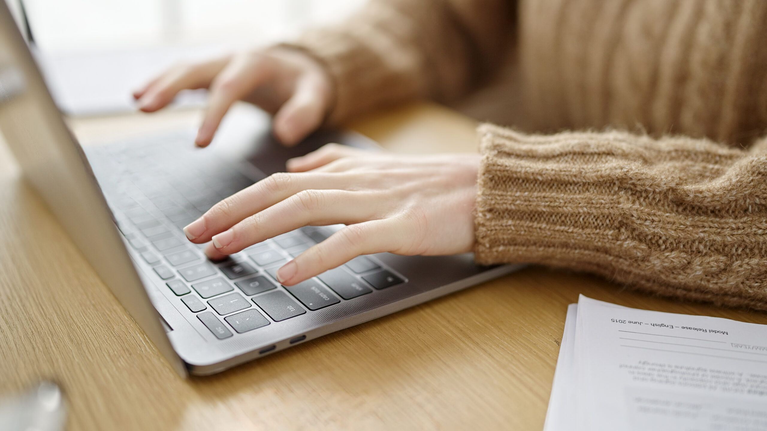 young beautiful hispanic woman using laptop office 1 scaled